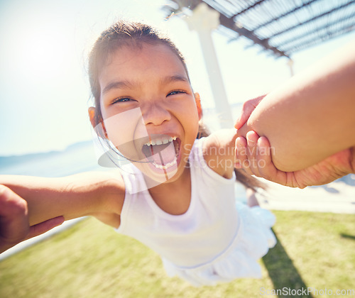 Image of Girl child, pov spin and happy portrait with speed, smile and ocean park in summer sunshine with happiness. Young female kid, swing and playing outdoor with fast movement, holding hands and freedom