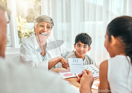 Image of Education, cards and grandparents with children and letter lesson for language, study and alphabet. School, homework and help with family at table and teaching for language, literacy and phonics