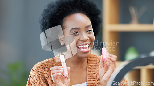 Image of A female influencer recording a makeup tutorial for her beauty blog or live streaming channel at home. Young woman creating content and engaging with her viewers and subscribers during an online vlog