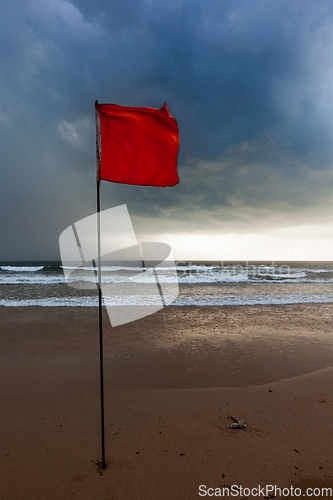 Image of Storm warning flags on beach. Baga, Goa, India