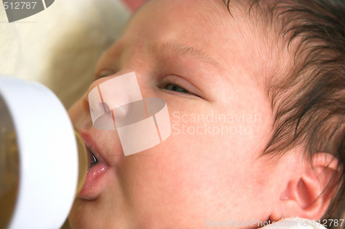 Image of baby drinking from nursing bottle