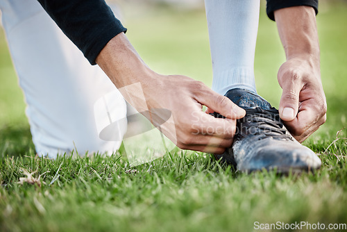 Image of Closeup, fitness and man tie shoe, hands and exercise for wellness, healthy lifestyle and on field. Zoom, male athlete and player with shoelace, training or workout for balance, sports or competition