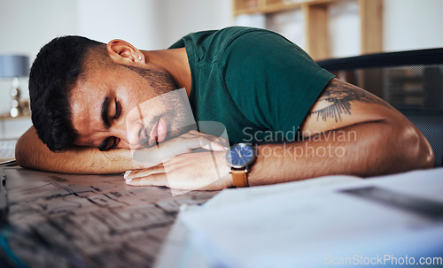 Image of Tired, burnout and man sleeping on a desk after studying, education or stress from remote work. Lazy, nap and student with fatigue, sleep and resting after learning, exam preparation and homework