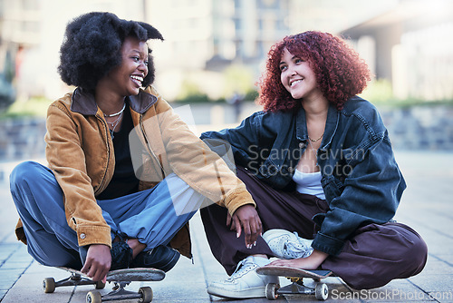 Image of Fun, skateboard and women in city, relax and workout with wellness, gen z and activity with happiness. Friends, girls and skaters with smile, quality time and fitness in town, resting or conversation