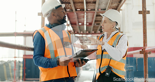 Image of Construction, inspection and clipboard, black man and woman discussion, construction site with scaffolding and building renovation checklist. Contractor with inspector, engineering and communication.