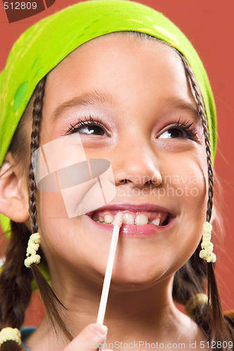 Image of child applying make-up
