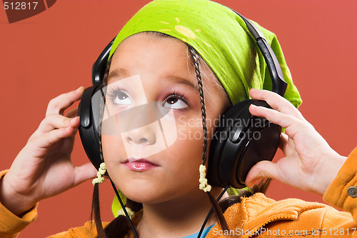 Image of child listening music 