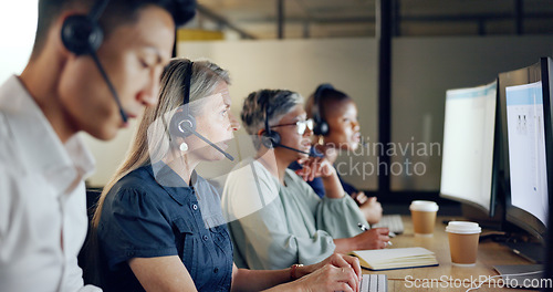 Image of Senior call center consultant, woman and contact us, CRM and talking in customer service, computer at desk. Phone call, telemarketing and diversity, writing in notebook in coworking space and headset