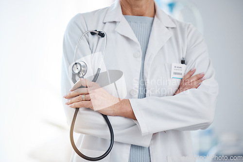 Image of Medicine, stethoscope and a doctor with arms crossed for healthcare, hospital work and cardiology. Insurance, nursing and a gp ready for a consultation, surgery or medical service at a clinic