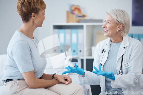 Image of Consulting, healthcare and woman speaking to a doctor about a surgery, medical attention or plan. Support, medicine and mature patient talking to a gp about cardiology, strategy or health advice