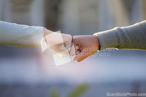 Image of Motivation, support and people with a fist bump for partnership, goal and teamwork. Thank you, community and friends with a hand gesture for collaboration, connection and solidarity in the city