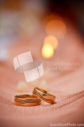 Image of wedding rings and candles