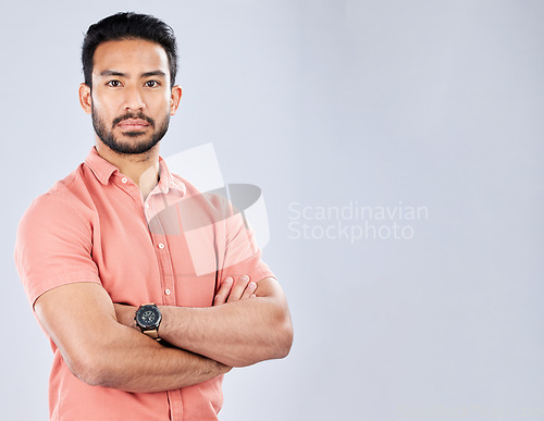 Image of Portrait, arms crossed and business man in studio isolated on a gray background mockup. Boss, professional or serious male entrepreneur from Singapore with career pride, confidence or success mindset