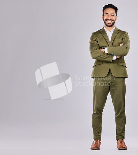 Image of Fashion, business and portrait of a man in a studio with a luxury, stylish and corporate suit. Happy, smile and full length of a male model with a fancy outfit by a gray background with mockup space.