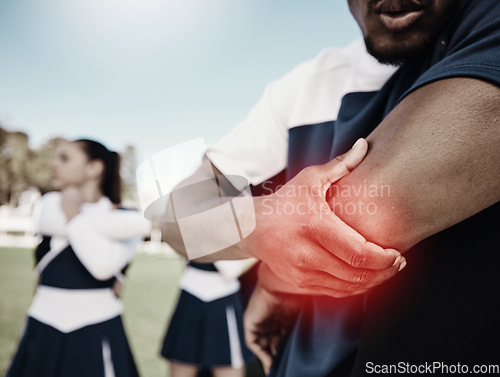 Image of Cheerleader, sports or hand on elbow injury, pain or accident on field in game or training match. Red glow, fitness zoom or cheerleading male person with a medical emergency, joint or muscle sprain