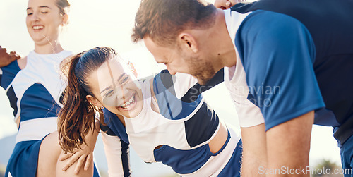 Image of Cheerleader, funny or people in cheerleading team talking, bonding or laughing while relaxing on field. Community, sports friends or group of happy cheerleaders with support or solidarity together