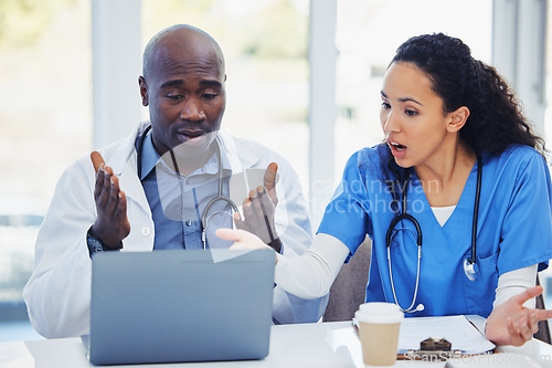 Image of Shocked, surprised and laptop of doctors with research, hospital meeting and medical results fail, risk or crisis. Discussion, confused and stress healthcare nurses, team or black people on computer