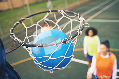 Image of Ball in net, netball and sports outdoor with team, fitness and active lifestyle with athlete on court. Sport, professional club and people playing game, success with goal and exercise with training