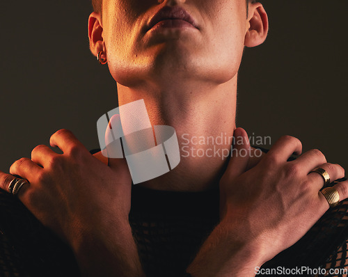 Image of Man, self love and hug in studio on a dark background for fashion, lgbt inclusion or gay pride. Hands, hugging and holding with a homosexual or androgynous male standing alone for body positivity