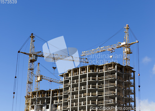 Image of tall yellow construction crane