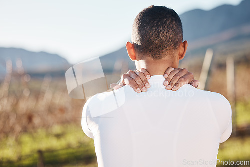 Image of Fitness, nature and man with a back injury, pain or accident after running training for race. Sports, medical emergency and male athlete with sprain muscle, injured or sore body after cardio workout.