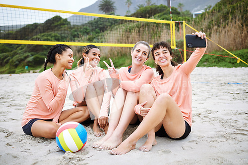 Image of Volleyball, peace sign and friends take selfie at the beach after exercise, workout or training. Teamwork smile, sports and group of women or girls taking pictures with v hand emoji for happy memory