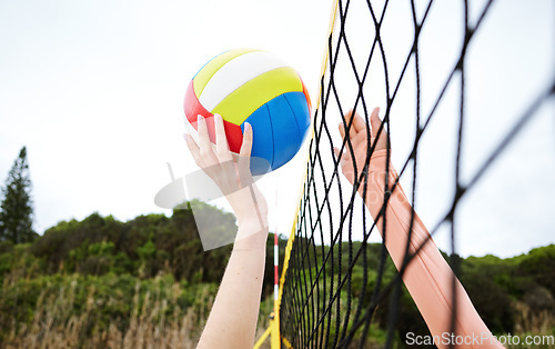 Image of Hands, fitness and beach net volleyball with woman scoring goals in competition, game or match. Sports, training and female athlete holding ball in tournament to score for exercise or workout outdoor