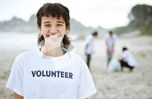 Image of Smile, portrait and volunteer woman at beach for cleaning, recycling or environmental sustainability. Earth day, happy face and proud female for community service, charity and climate change at ocean