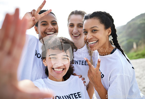 Image of Peace sign, selfie and volunteer women at beach taking photo for earth day, environmental sustainability or recycling. V emoji, community service and group portrait of happy girls or friends laughing