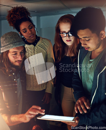 Image of Teamwork collaboration, tablet and night students work on university app database, problem solving or IT college research. Education learning, school study and diversity people review online software