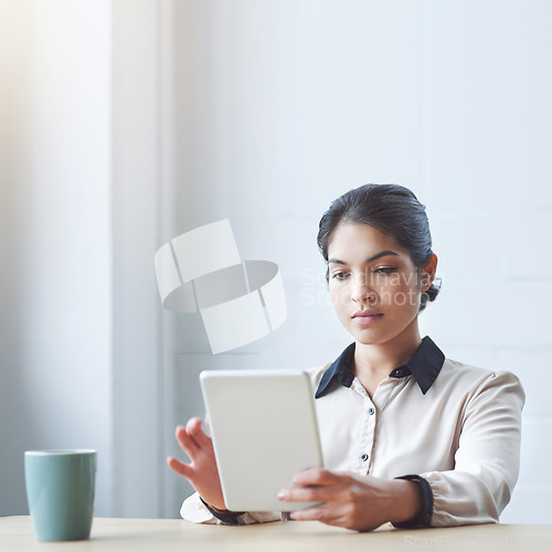 Image of Business woman, tablet and reading in office with serious internet research or strategy for goals. Young executive, touchscreen and brainstorming for ideas, focus or website management in mockup