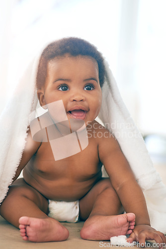 Image of Cute baby, black girl and blanket to play, game and peekaboo in nursery room, happiness and fun. Happy young infant child, kids and smile for healthy development, growth and laughing face in house