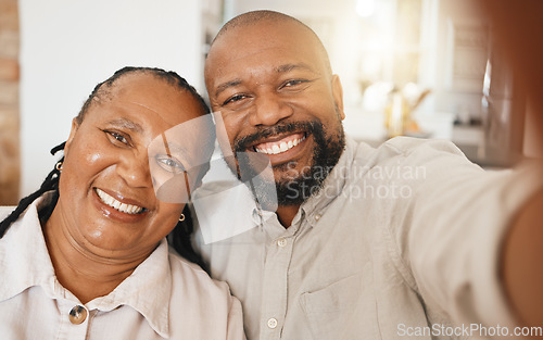 Image of Smile, selfie and mature black couple in home with happiness and love in relationship together. Self portrait, happy face and man with woman taking romantic picture for social media in South Africa.