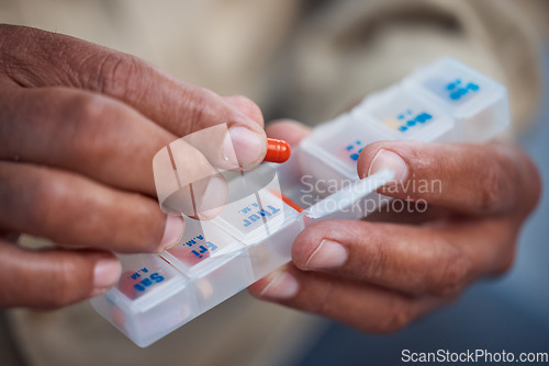 Image of Medicine, container and hands of old person with pills for organize, healthcare and prescription. Medical, pharmacy and wellness with senior citizen and medication for vitamins, antibiotics and drugs