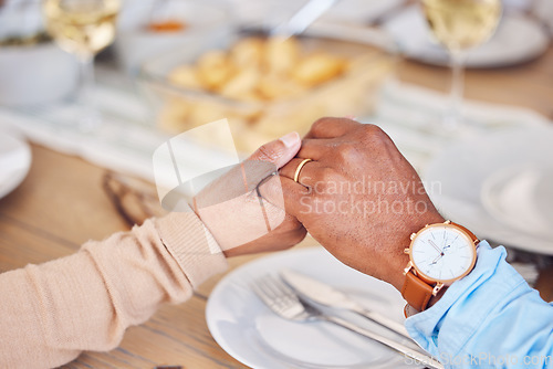 Image of Holding hands, people and praying thanks on food, lunch or worship at dinner table. Closeup, prayer and eating together in religion, trust or appreciation of christian support, respect or care of god