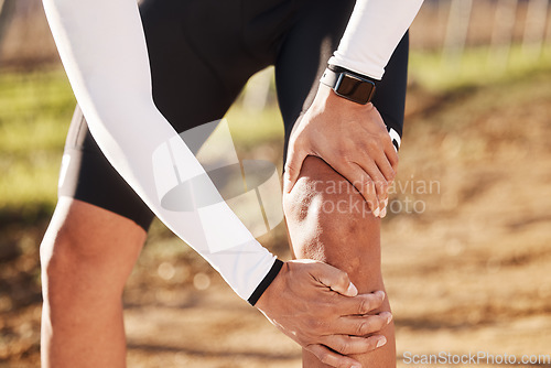 Image of Knee pain, fitness injury and outdoor training of athlete with running, exercise and workout issue. Leg joint inflammation, runner hands and leg massage for a run accident in nature with a bruise