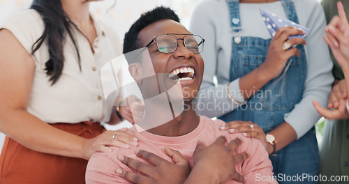 Image of Applause, winner and motivation with a business black man in the office with his team for celebration. Surprise, laugh and comgratulations for a male employee from his work friends or colleague group