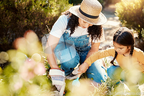 Image of Love, mother and girl in garden, relax and happiness with bonding, loving and cheerful together. Family, mama and daughter outdoor, backyard and planting for growth, flowers and child development