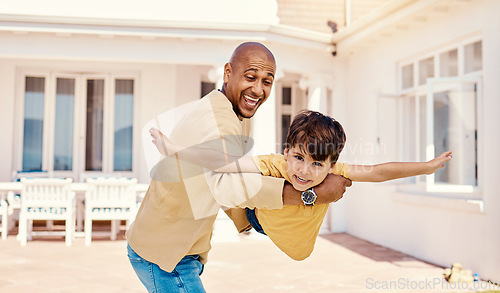 Image of Playing, flying and portrait of a child with a father for freedom, imagination or bonding. Happy, play and carefree dad holding boy kid to pretend to fly, adventure and happiness together at home