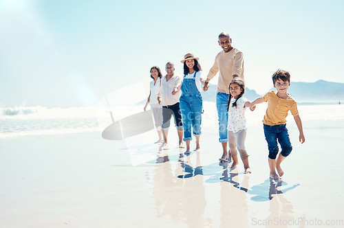 Image of Happy, portrait and a big family holding hands at the beach for a walk, bonding and playing. Love, carefree and children walking at the sea with grandparents and parents on a holiday in Spain