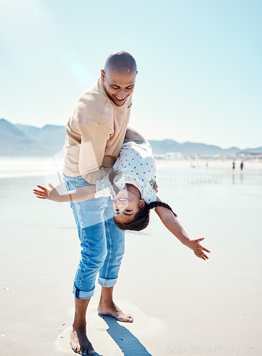 Image of Family, beach and father carry girl playing by ocean for bonding, quality time and relaxing on weekend. Love, nature and happy dad holding child on summer holiday, vacation and adventure together