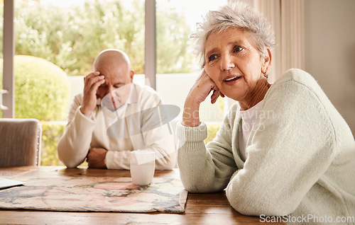 Image of Senior couple, divorce and stress with fight, depression and breakup in living room, angry and financial crisis. Old man, mature woman or toxic relationship with anger, sad or mental health in lounge