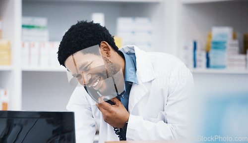 Image of Pharmacist, black man or phone call for patient help, customer consulting or telehealth medicine research in drugstore. Smile, happy or talking pharmacy worker on telephone, computer or pills order