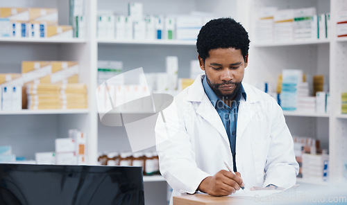 Image of Pharmacist, stock or black man writing on clipboard for medicine check, retail research or medical prescription in drugstore. Notes, pharmacy or worker on paper documents in pills checklist or order