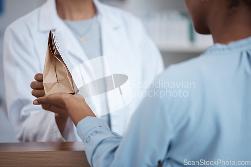 Image of Hands, pharmacy and customer shopping for medicine, product or medication. Healthcare, wellness and black woman buying pills, supplements or medical drugs from pharmacist in drugstore or retail shop.