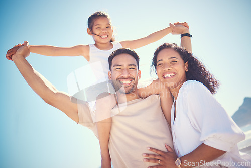 Image of Portrait, beach and happy family smile, piggyback and bond outdoor against blue sky background. Travel, face and girl with parents on an ocean vacation, holiday or trip in Miami, excited and cheerful