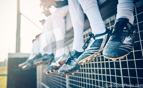 Image of Baseball feet, team and sport field stadium for fitness, workout and game exercise. Softball shoes, sports group and summer outdoor with people sitting on an athlete training break together
