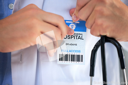 Image of Hospital ID, doctor hands and clinic access pass of general health practitioner with stethoscope. Icu card, nurse and medical worker ready for working and healthcare help with a wellness card