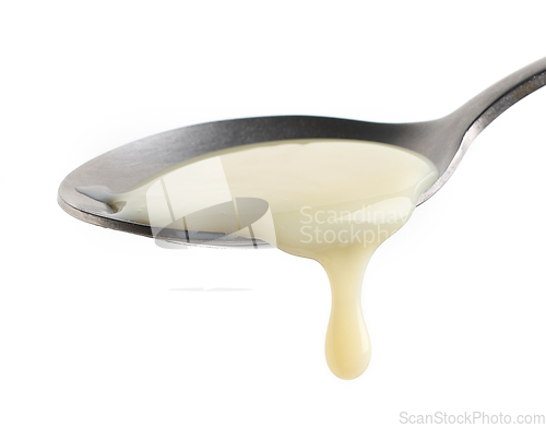 Image of condensed milk in a spoon