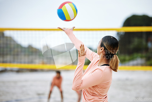 Image of Volleyball, beach or serve of sports women playing a game in training or workout in summer together. Team fitness, freedom or healthy friends on sand ready to start a fun competitive match in Brazil